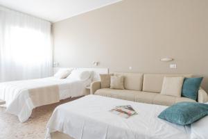 A bed or beds in a room at Residence Sabrina