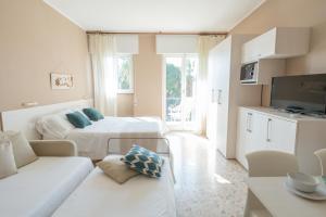 A bed or beds in a room at Residence Sabrina