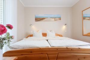 Postel nebo postele na pokoji v ubytování Haus Duene