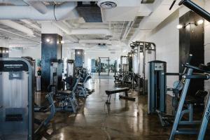 a gym with treadmills and machines in a room at Uptown 1br w fire pits rooftop nr L red line CHI-979 in Chicago