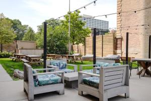 a group of chairs and tables in a yard at Uptown 1br w fire pits rooftop nr L red line CHI-979 in Chicago