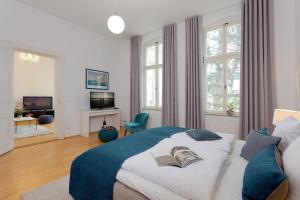 a bedroom with a bed with two books on it at Villa Schlossbauer Nr 09 in Heringsdorf