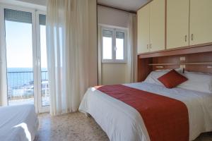 A bed or beds in a room at Residence Sabrina