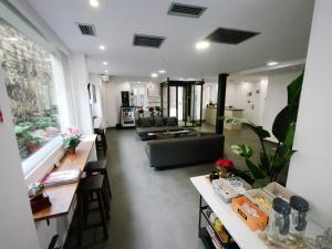 a living room with a couch and a table at Hotel Myro in Gijón