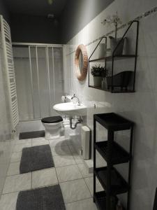 a bathroom with a sink and a toilet at am Conradhof in Goch