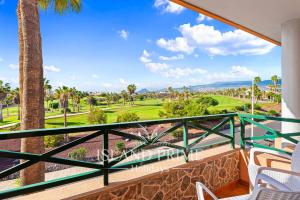 a balcony with a view of a golf course at Golf and Sea Views Holiday in Golf del Sur in San Miguel de Abona