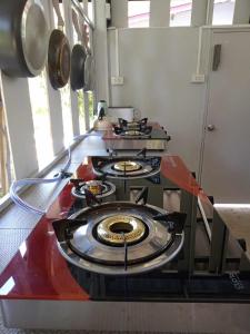 a kitchen with three burners on a counter top at family resort in Ko Phayam