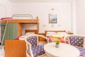 Postel nebo postele na pokoji v ubytování Alexander Beach Hotel