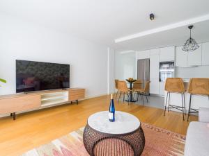 a living room with a couch and a table at Sea City by CanariasGetaway in Las Palmas de Gran Canaria