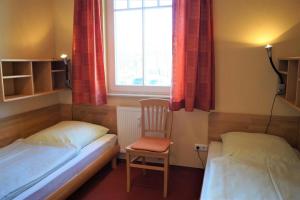 Postel nebo postele na pokoji v ubytování Fewo in Strandnähe mit 2 Balkonen und Sauna