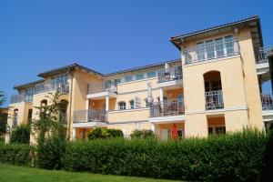 a large building with balconies on the side of it at Casa Nova, Wohnung 16 in Kühlungsborn