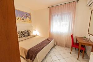 Postel nebo postele na pokoji v ubytování Hotel Paistos Paestum