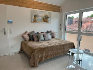 Postel nebo postele na pokoji v ubytování DG-Wohnung in Starnberg Nord + 3 fotografie
