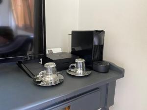 Příslušenství pro přípravu čaje a kávy v ubytování Casa Molino Hotel Boutique & Restaurant Puerto Varas