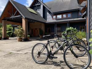 two bikes parked in front of a house at Casa Molino Hotel Boutique & Restaurant Puerto Varas in Puerto Varas