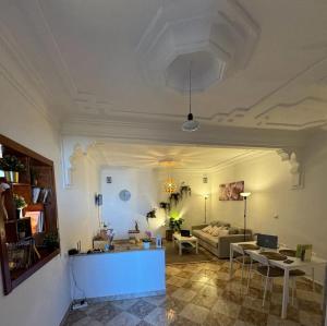a living room with a couch and a table at Dar Saphire Apartments in Chefchaouen