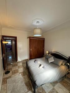 a bedroom with a large bed in a room at Dar Saphire Apartments in Chefchaouen