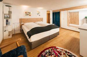 a bedroom with a large bed in a room at Villa Marwa - eine Ruheoase im Grünen in Innsbruck