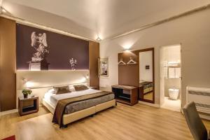 a bedroom with a king sized bed and a bathroom at HiSuiteROME - ApartHotel in Rome