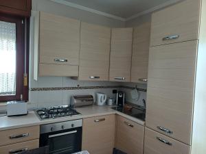 A kitchen or kitchenette at NSM Casa di Fulmine attico con box privato