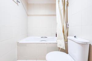 a bathroom with a toilet and a bath tub at Cordia Residence Sathorn in Bang Rak +40 photos