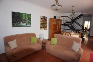 a living room with two chairs and a couch at !Your Home In Madeira in Funchal