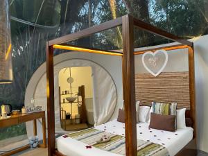 Voodi või voodid majutusasutuse Bubble Lodge Bois Chéri Plantation toas