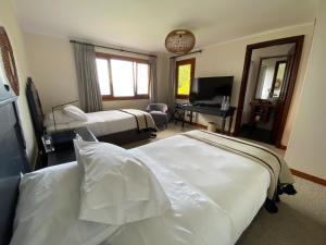 Postel nebo postele na pokoji v ubytování Casa Molino Hotel Boutique & Restaurant Puerto Varas