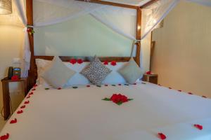 Postel nebo postele na pokoji v ubytování Alma Boutique Hotel