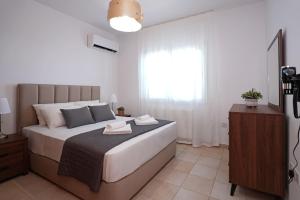 Postel nebo postele na pokoji v ubytování Cape Panorama Villa