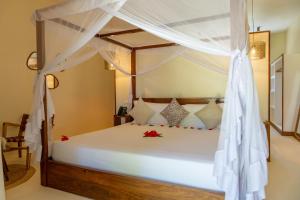 Postel nebo postele na pokoji v ubytování Alma Boutique Hotel