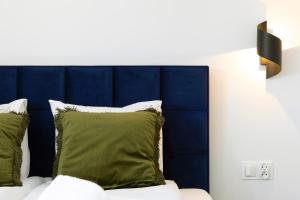 Ein Bett oder Betten in einem Zimmer der Unterkunft Elite Apartments Ogarna Suite