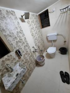 a bathroom with a sink and a toilet at Antalya Villa in Malavli +10 photos