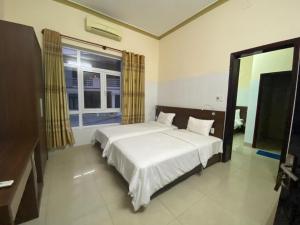 Ліжко або ліжка в номері Nhà Khách 206 đà nẵng