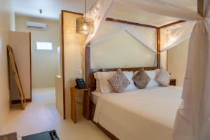 Postel nebo postele na pokoji v ubytování Alma Boutique Hotel