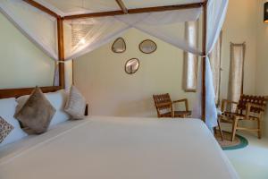 Postel nebo postele na pokoji v ubytování Alma Boutique Hotel