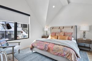 a bedroom with a large bed and a window at Hotel Whiskey in Park City