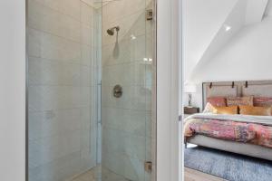 a shower with a glass door in a bedroom at Hotel Whiskey in Park City