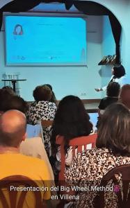 a group of people sitting in front of a presentation at Hostal los Aromas in Villena