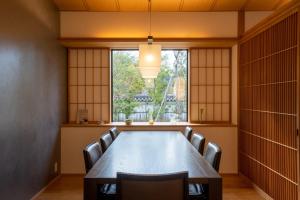 a conference room with a long table and chairs at Aoi Suites at Nanzenji Modern & Traditional Japanese Style in Kyoto