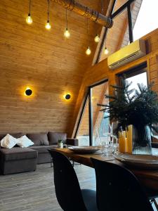 a living room with a table and a couch at Тихий куточок in Izki