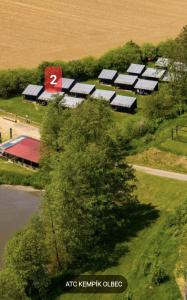 an overhead view of a group of barns and a lake at Chatky Kempík in Olbramkostel