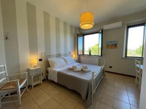A bed or beds in a room at Agriturismo con cucina Il Favaio
