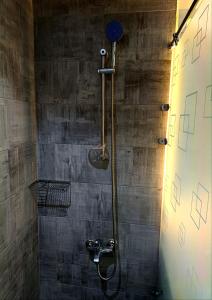 a bathroom with a shower with a shower head at Scandic Resort Apartment B 608 Hurghada in Hurghada