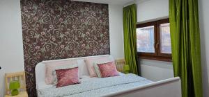 Postel nebo postele na pokoji v ubytování AG Apartment Gabčíkovo + 35 fotografií