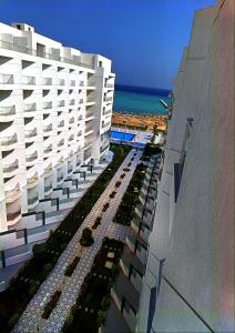an aerial view of a building and the ocean at Scandic Resort Apartment B 608 Hurghada in Hurghada