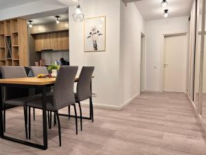 a dining room with a table and chairs at Industrial style in Bucharest