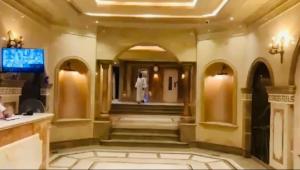 a lobby of a hotel with a man walking down the stairs at وحده فندقيه الخمائل علي المحور واركان بلازا زايد in Cairo