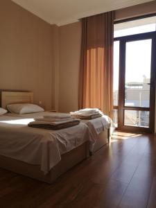 Letto o letti in una camera di FRESH Hotel Kobuleti