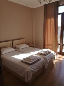 Letto o letti in una camera di FRESH Hotel Kobuleti